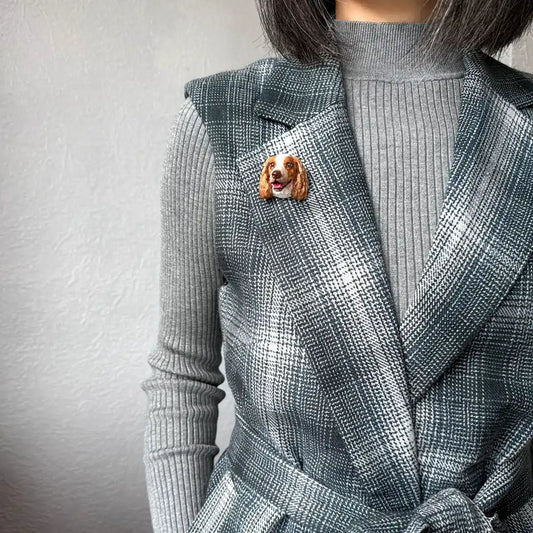 Handcrafted orange & white Springer Spaniel brooch with lifelike detail and UV glossy finish wearing