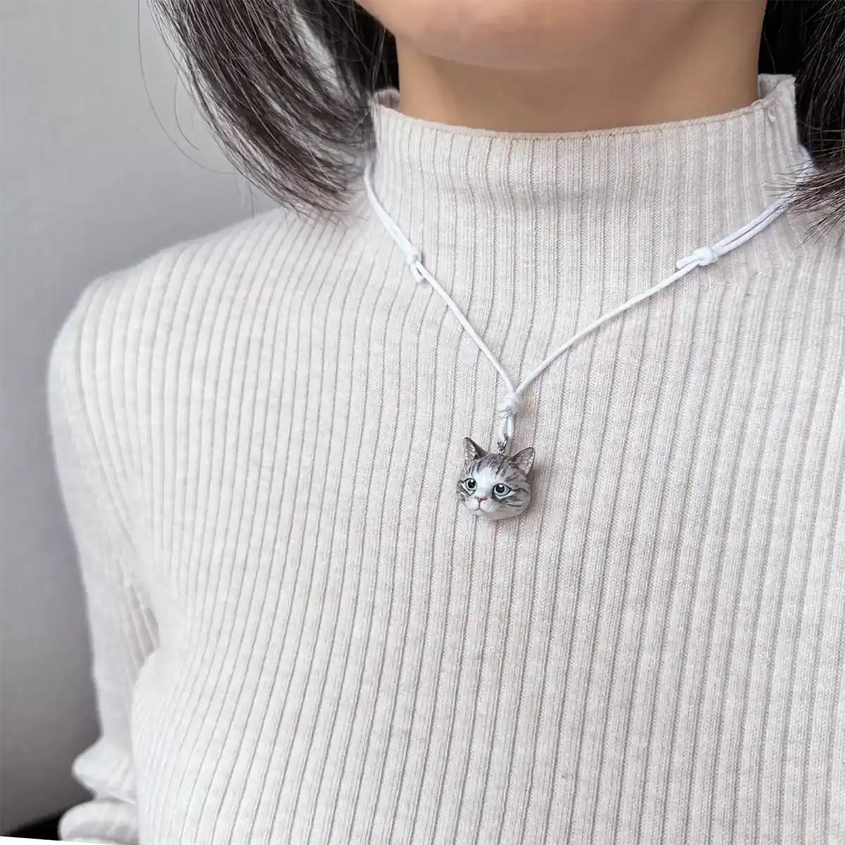 cat domestic shorthair tabby silver white diamond pendant necklace wearing