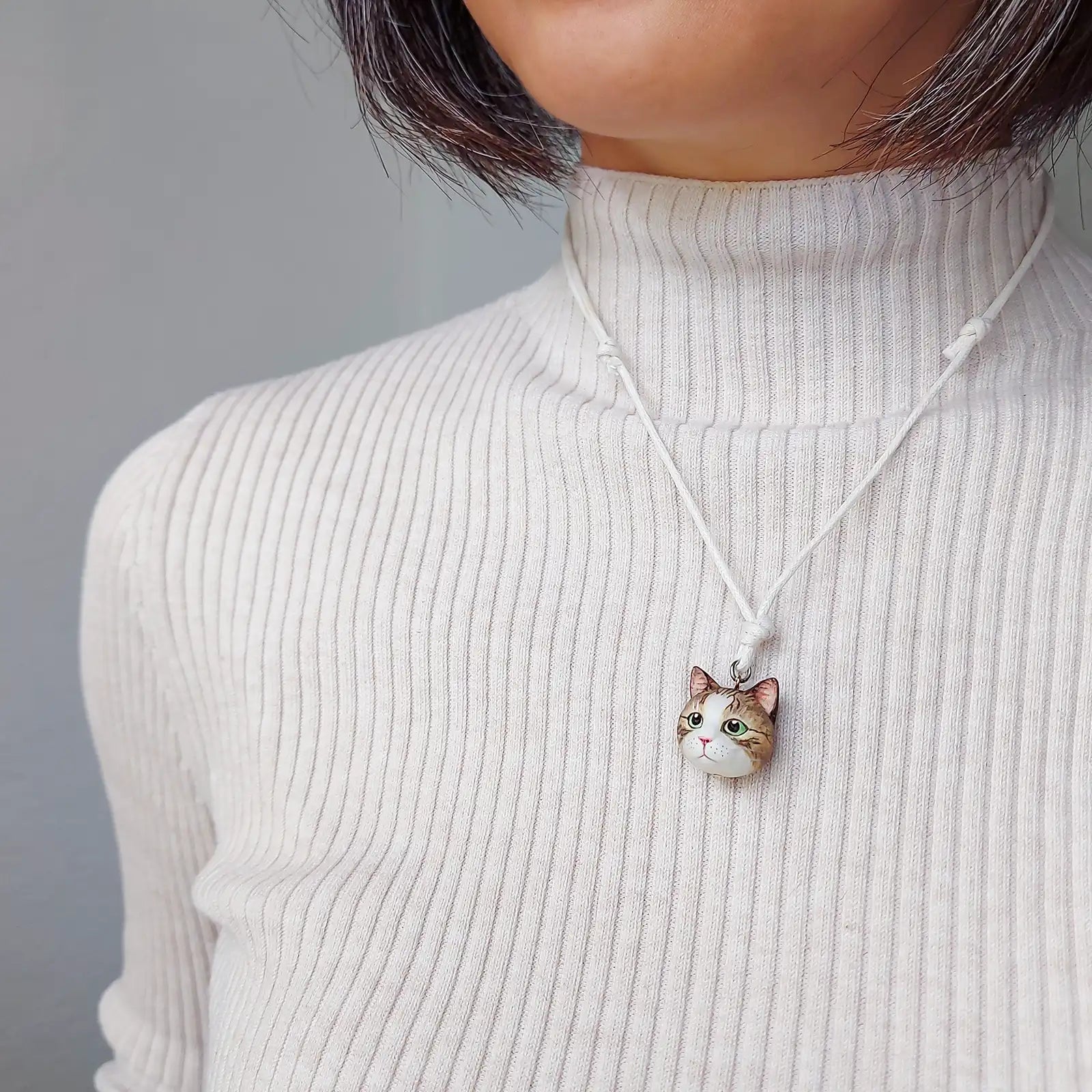 cat Domestic shorthair tabby white pendant wearing