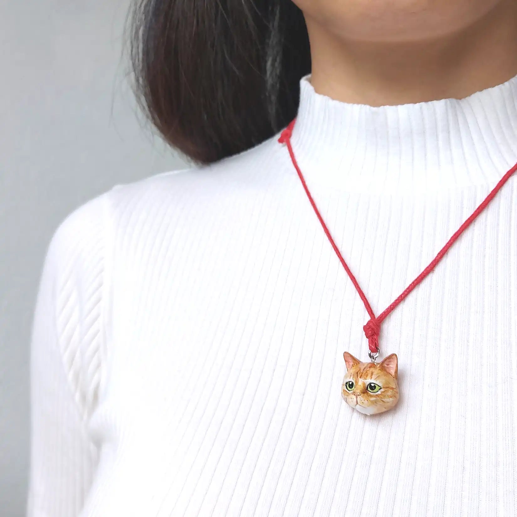 wearing cat domestic diamond shape ginger pendant