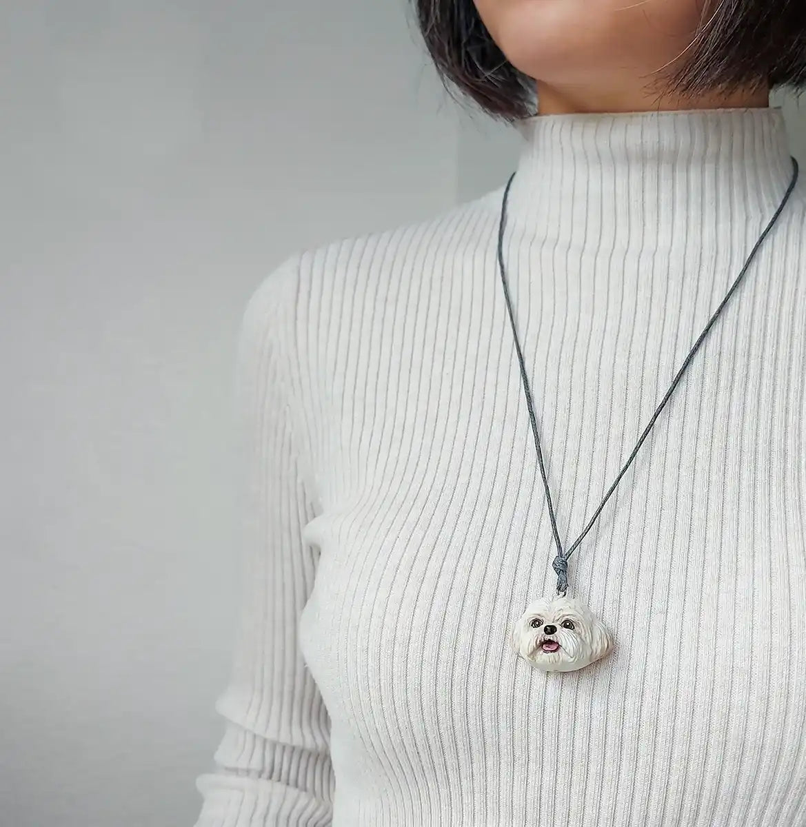 Large white Shih Tzu dog necklace in resin, detailed and hand-painted with UV protection coat wearing